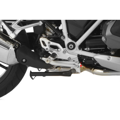 Zníženie páky nožnej brzdy...